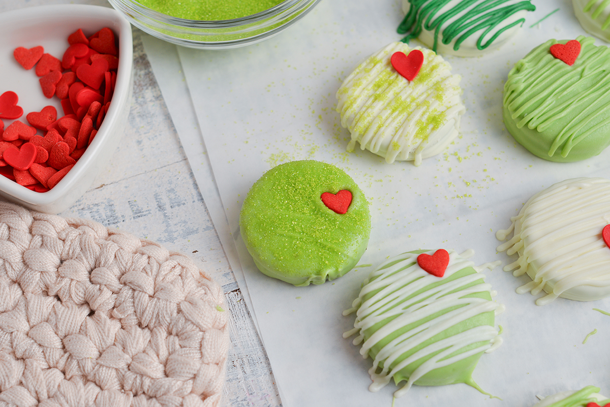 overhead shot of grinch cookies drizzled with chocolate