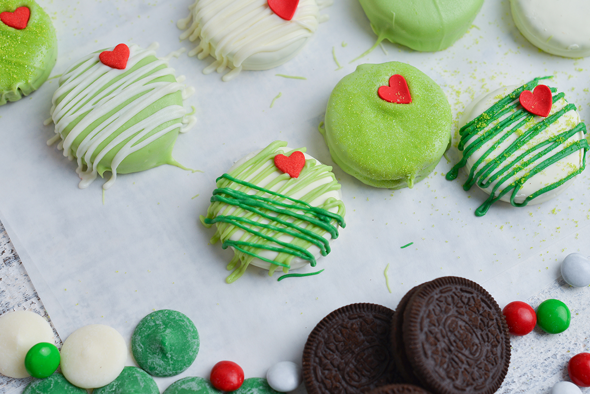close up angled shot of grinch cookies on parchment paper