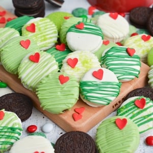 angled shot of grinch oreos on wooden board
