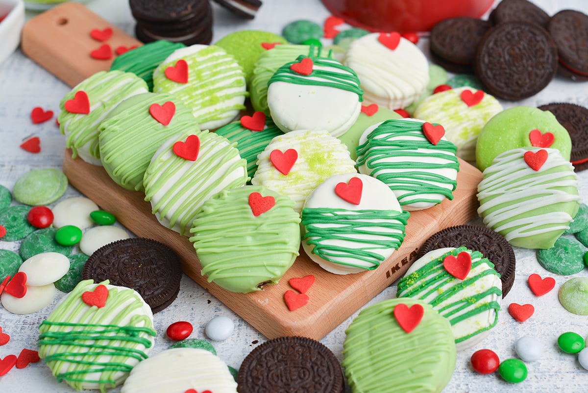 angled shot of grinch oreos on wooden board