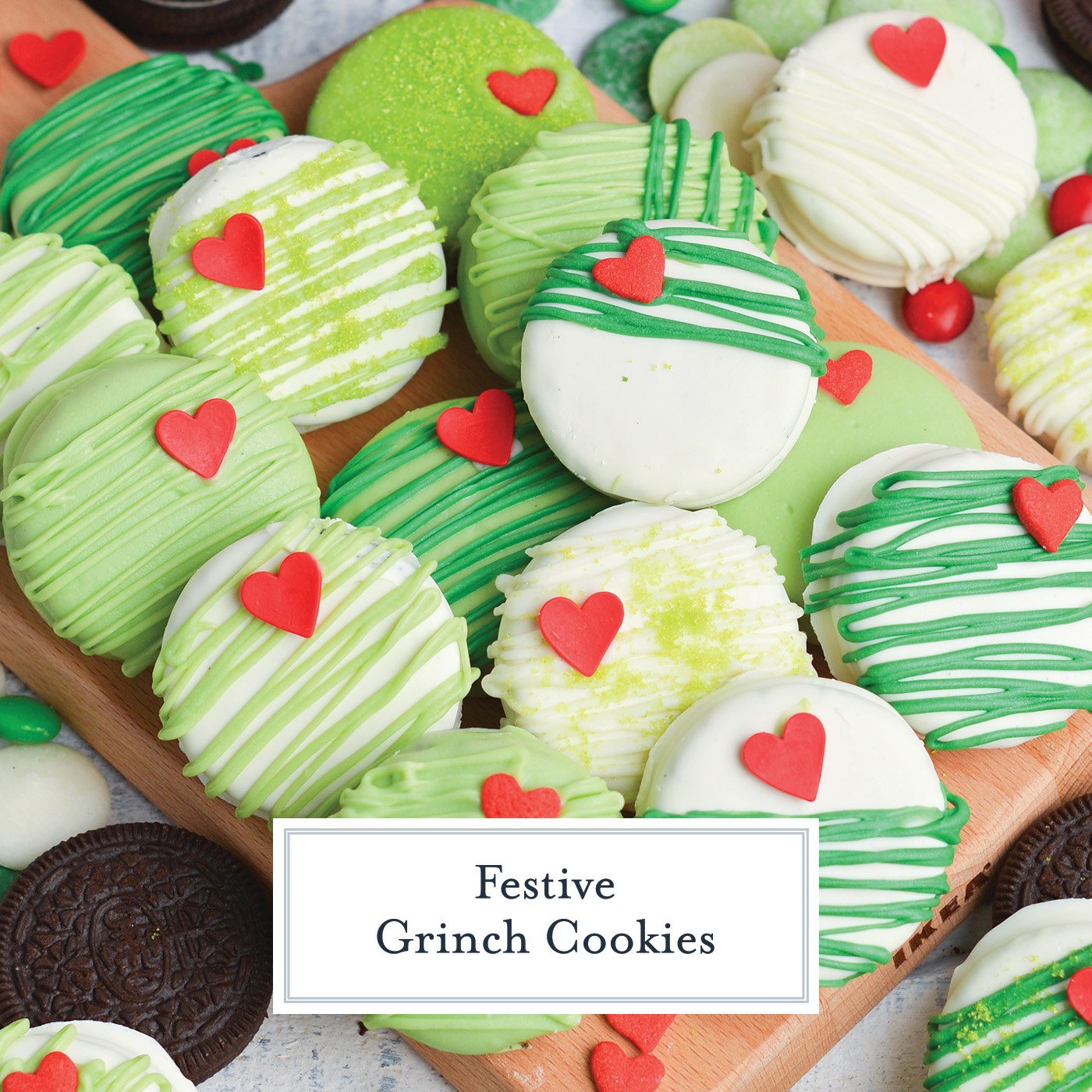 overhead shot of grinch cookies on tray with text overlay for facebook