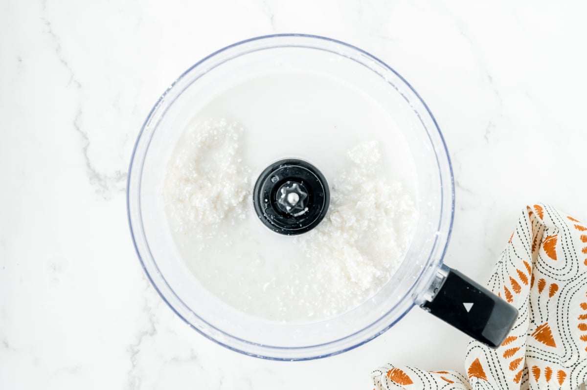 rice in food processor with milk and vanilla