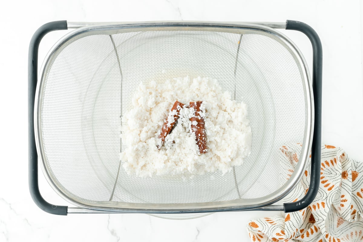 cinnamon and rice in strainer