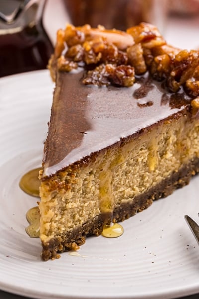 angled close up shot of slice of maple cheesecake on plate