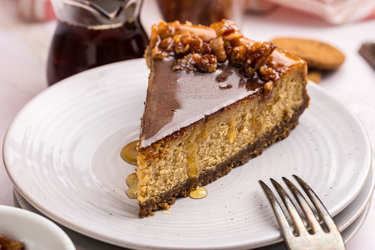 angled close up shot of slice of maple cheesecake on plate