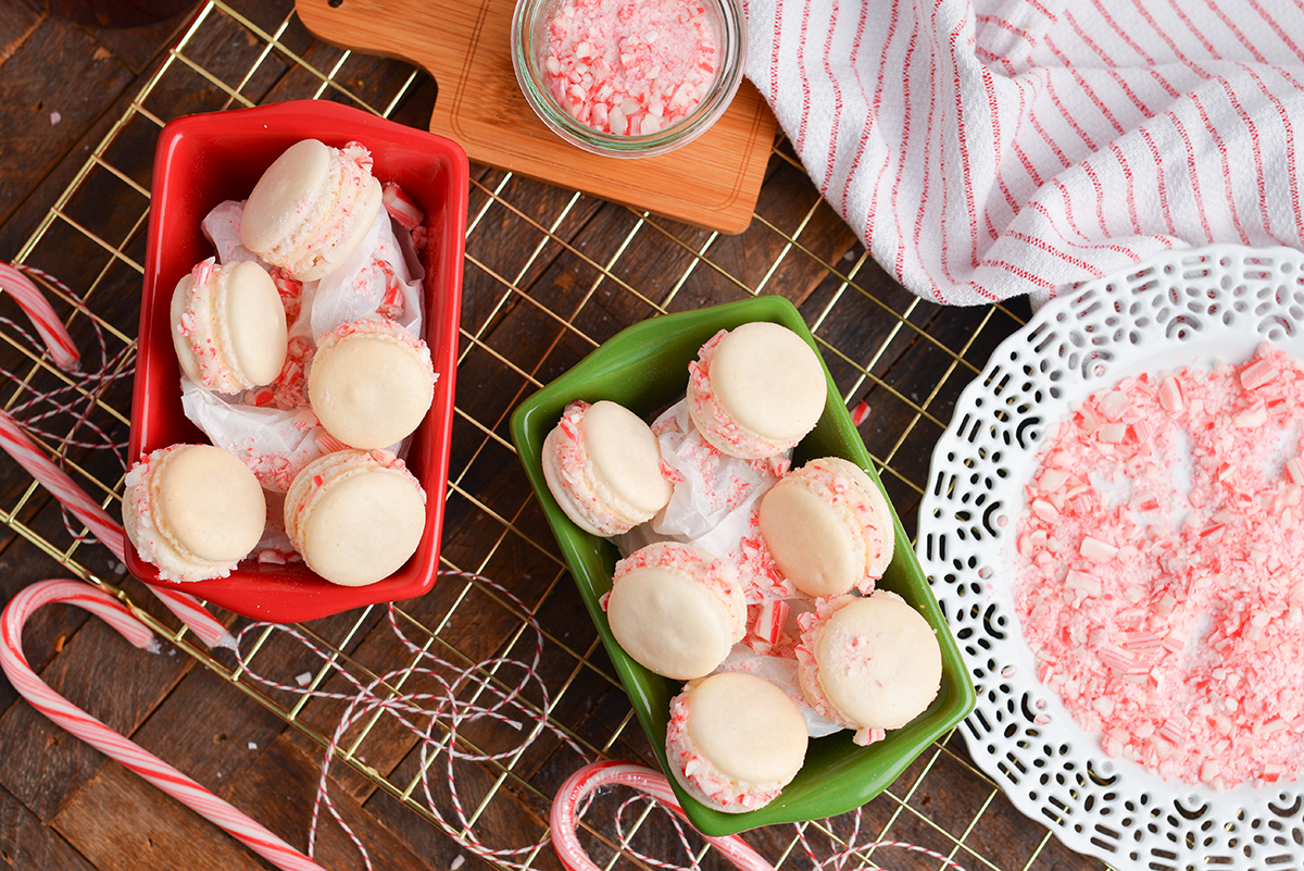 overhead of two small loaf pans with macaron cookie sandwiches