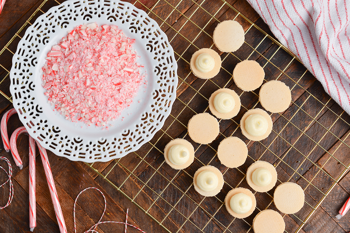 filling macaron shells with buttercream frosting