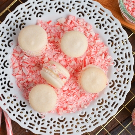 peppermint macarons in crushed candy on a white plate