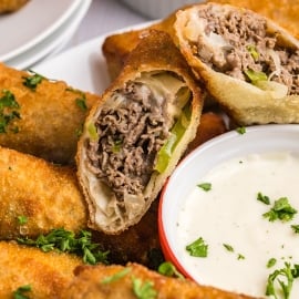 close up of philly cheesesteak egg roll cut in half