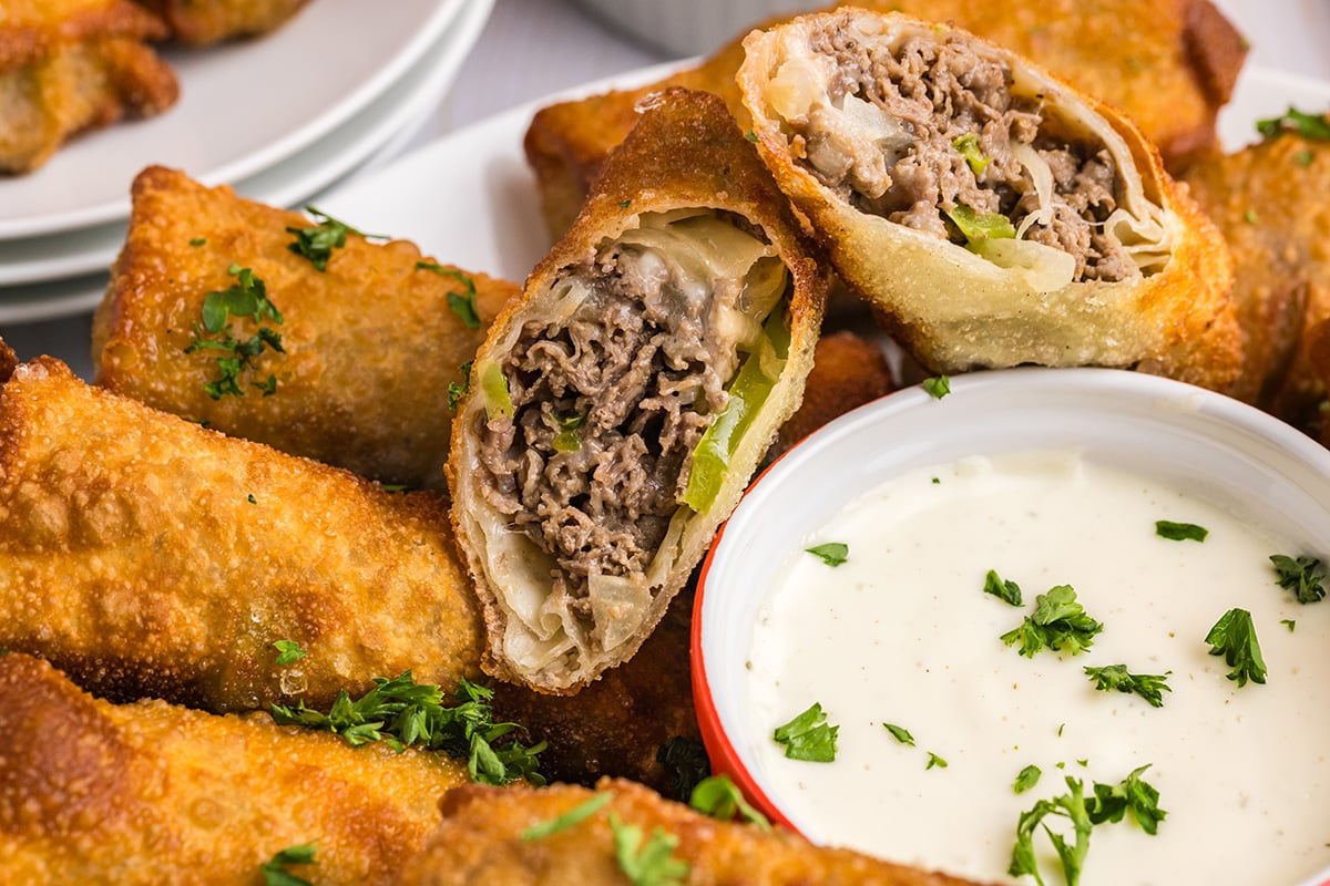 close up of philly cheesesteak egg roll cut in half