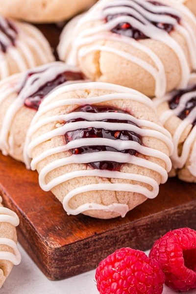 angled shot of tray of thumbprint jam cookies