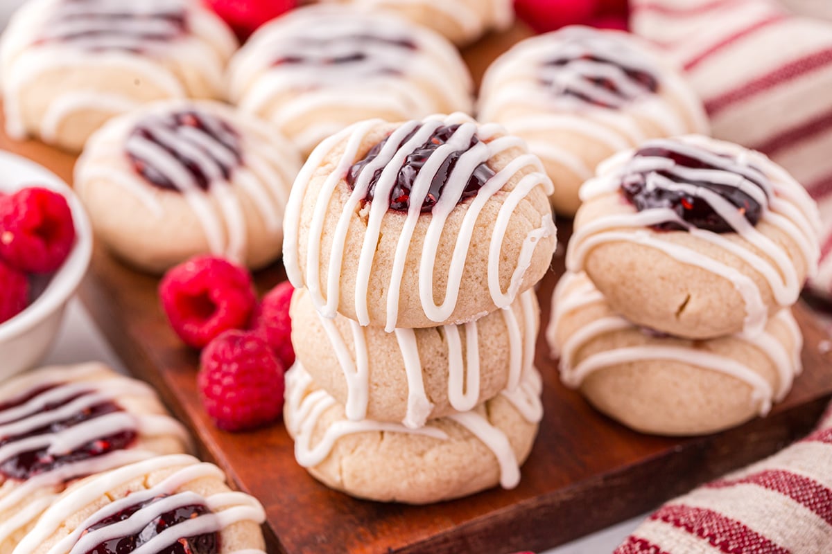 close up of stack of thumbprint jam cookies