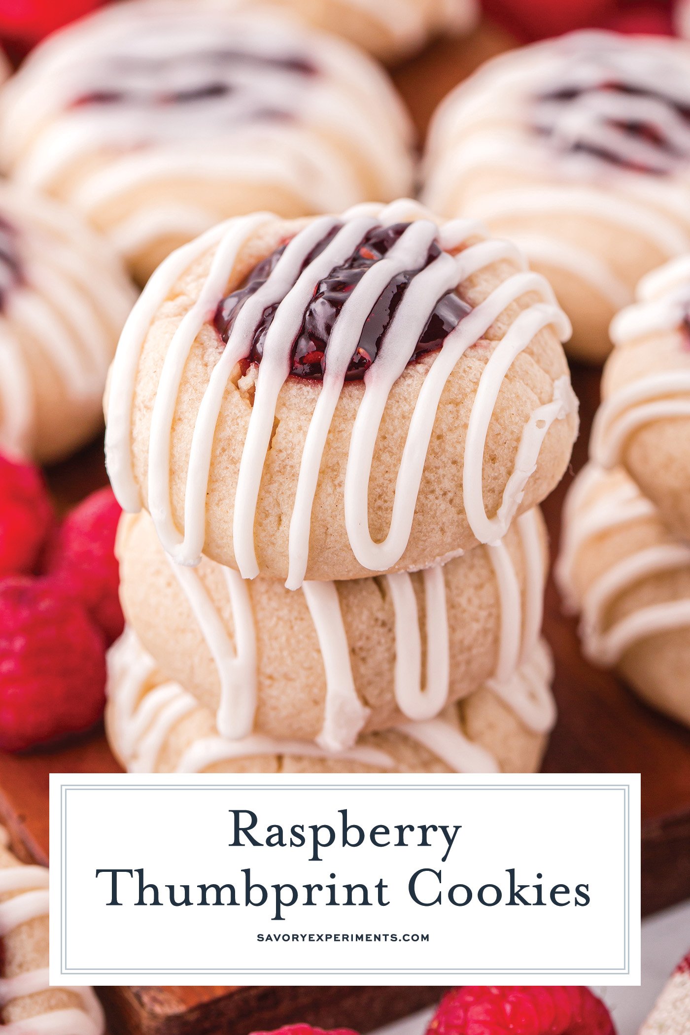 angled shot of stack of thumbprint jam cookies with text overlay for pinterest