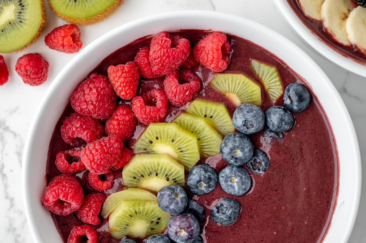 overhead half shot of fruit in acai bowl