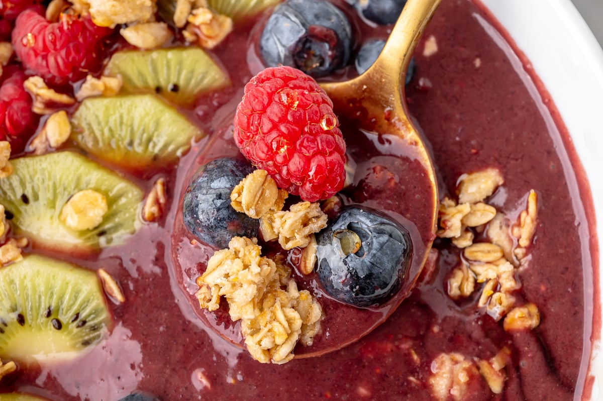 close up overhead shot of spoon full of smoothie