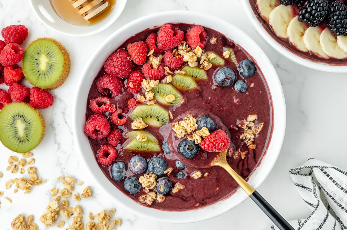 overhead shot of spoon in smoothie bowl