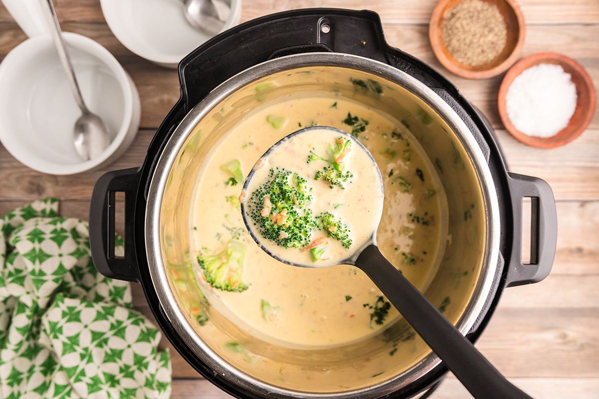 broccoli cheddar soup in a ladle