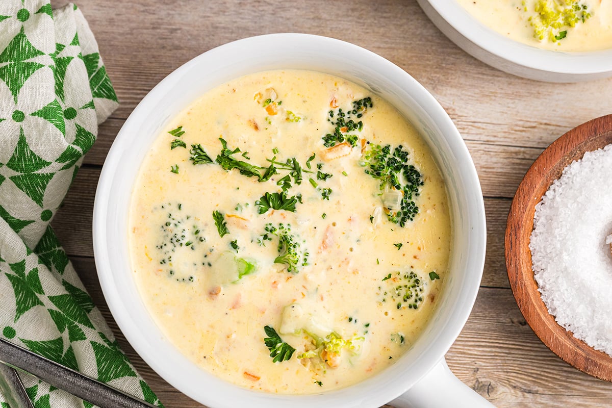 overhead bowl of creamy broccoli cheddar soup