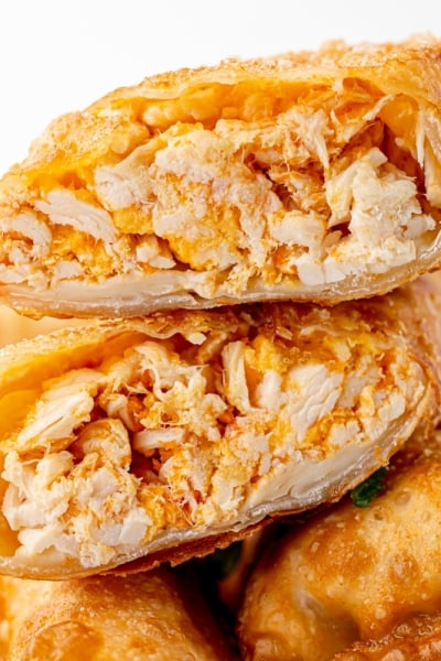 straight on shot of buffalo chicken egg roll cut in half