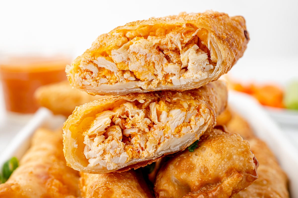 straight on shot of buffalo chicken egg roll cut in half