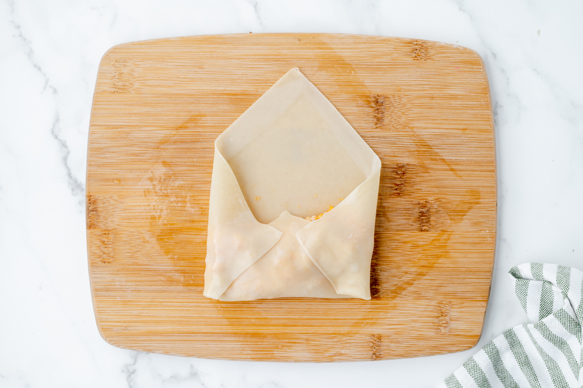 egg roll folded on cutting board