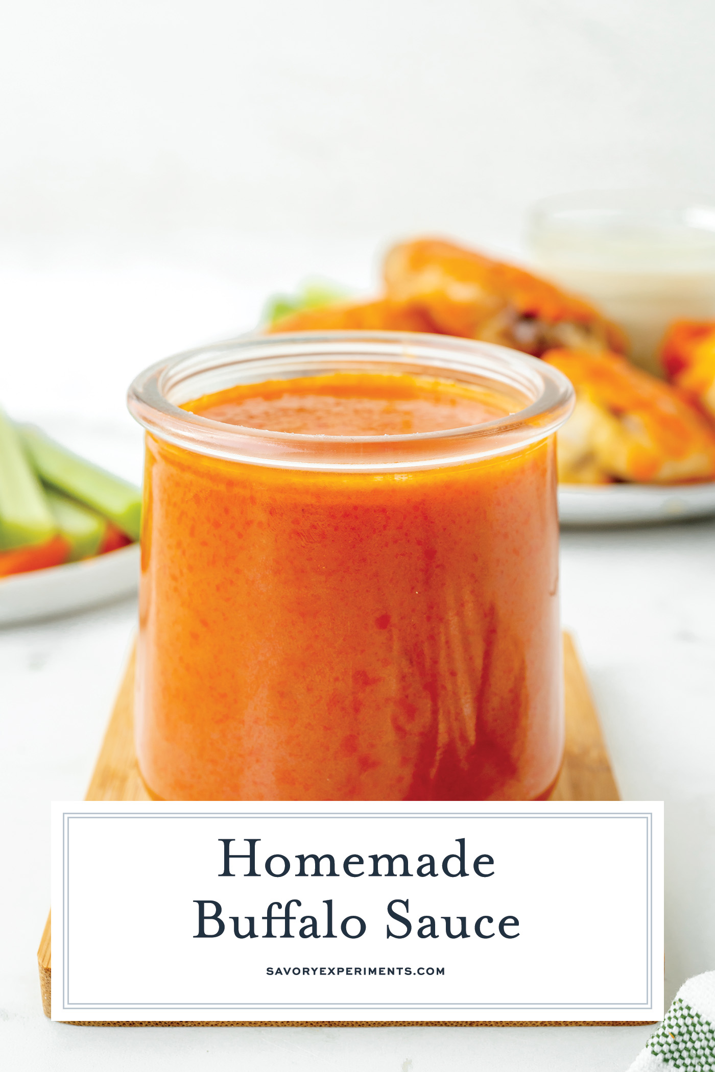 angled shot of jar of buffalo sauce with text overlay for pinterest