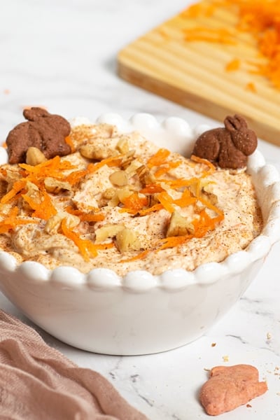 angled shot of carrot cake dip in a white bowl
