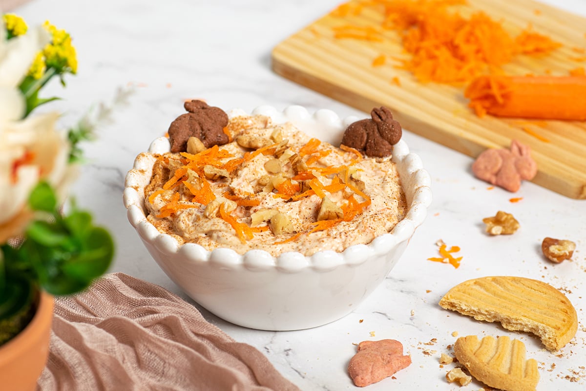 angled shot of carrot cake dip in a white bowl