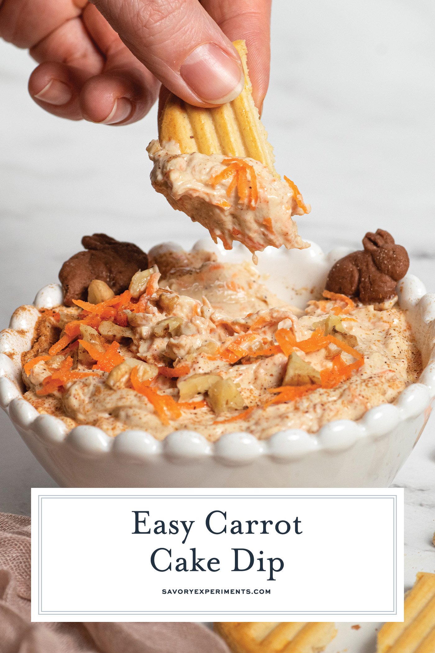 cookie dipping into carrot cake dip with text overlay for pinterest