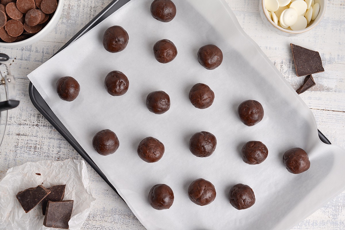 overhead shot of cheesecake bites on baking sheet