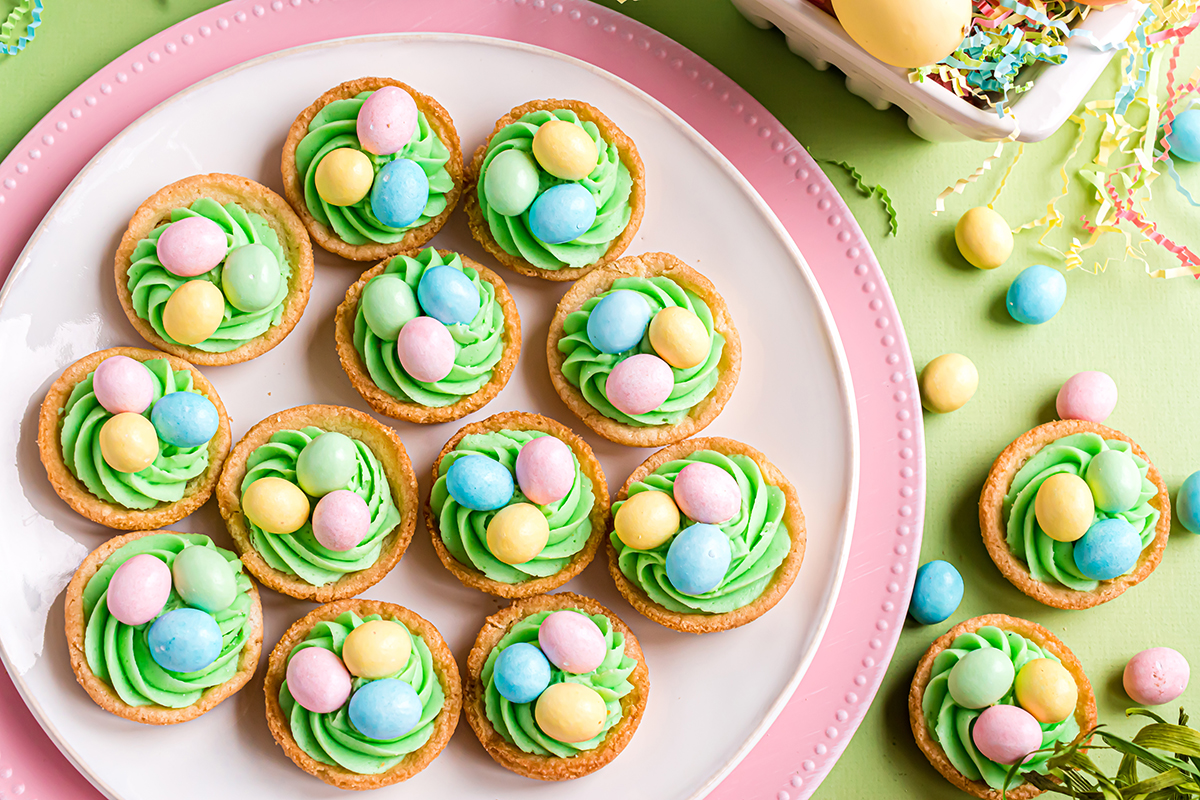 overhead shot of easter sugar cookie cups on white and pink plate