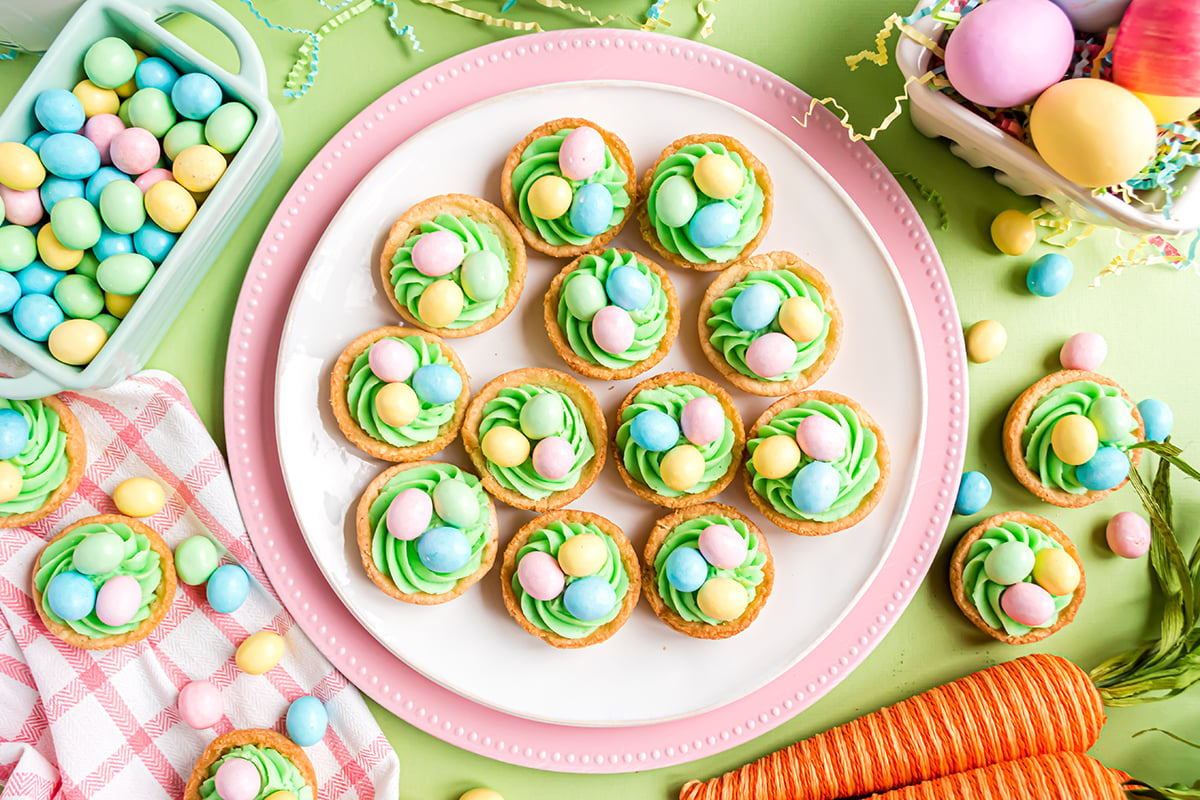overhead shot of easter sugar cookie cups on white plate