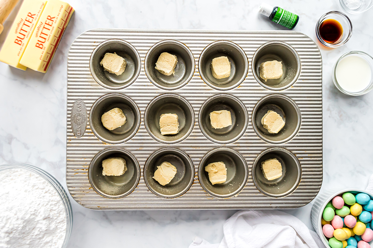 overhead shot of raw cookie dough in muffin tin