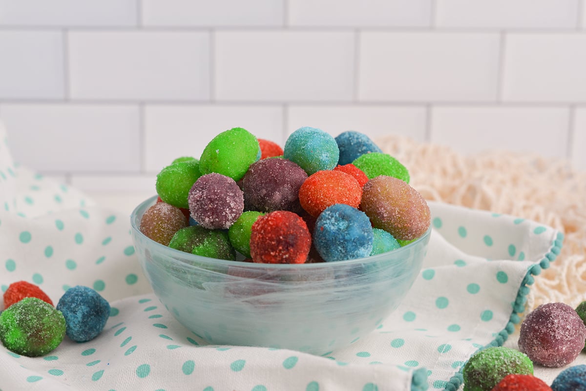 head on sugar covered grapes in a glass bowl