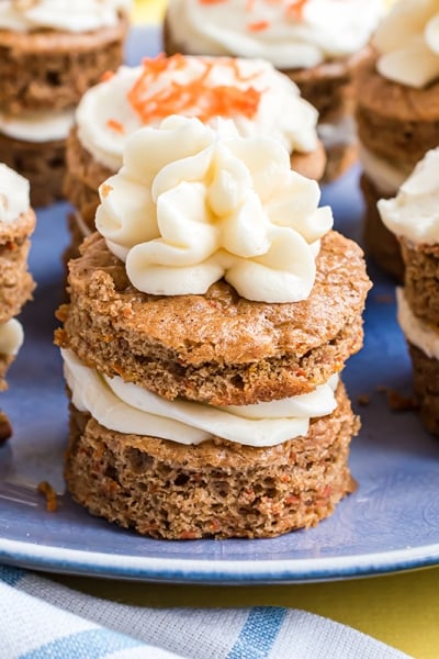 blue serving plate of individual carrot cakes