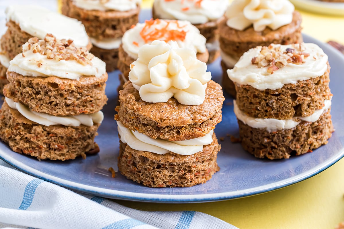 blue serving plate of individual carrot cakes