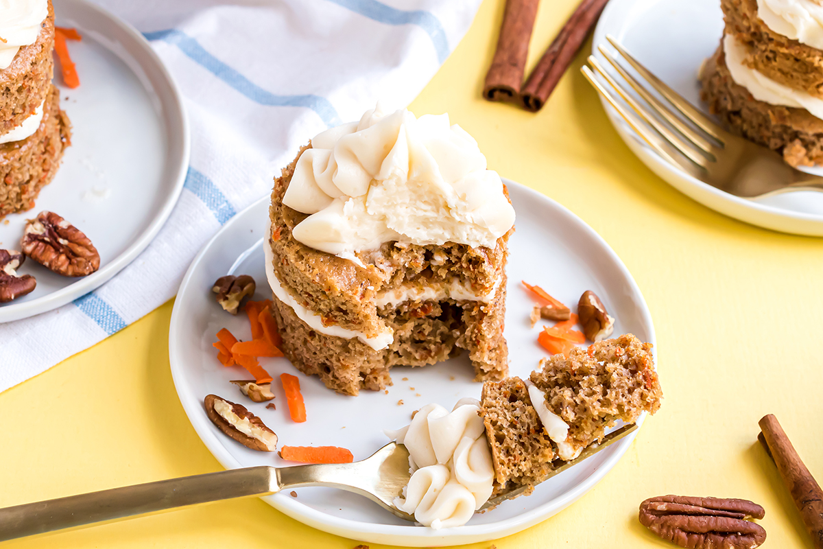 fork taking a bite out of mini carrot cake