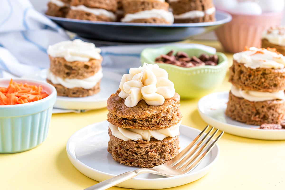carrot cake stack on a serving plate with fork