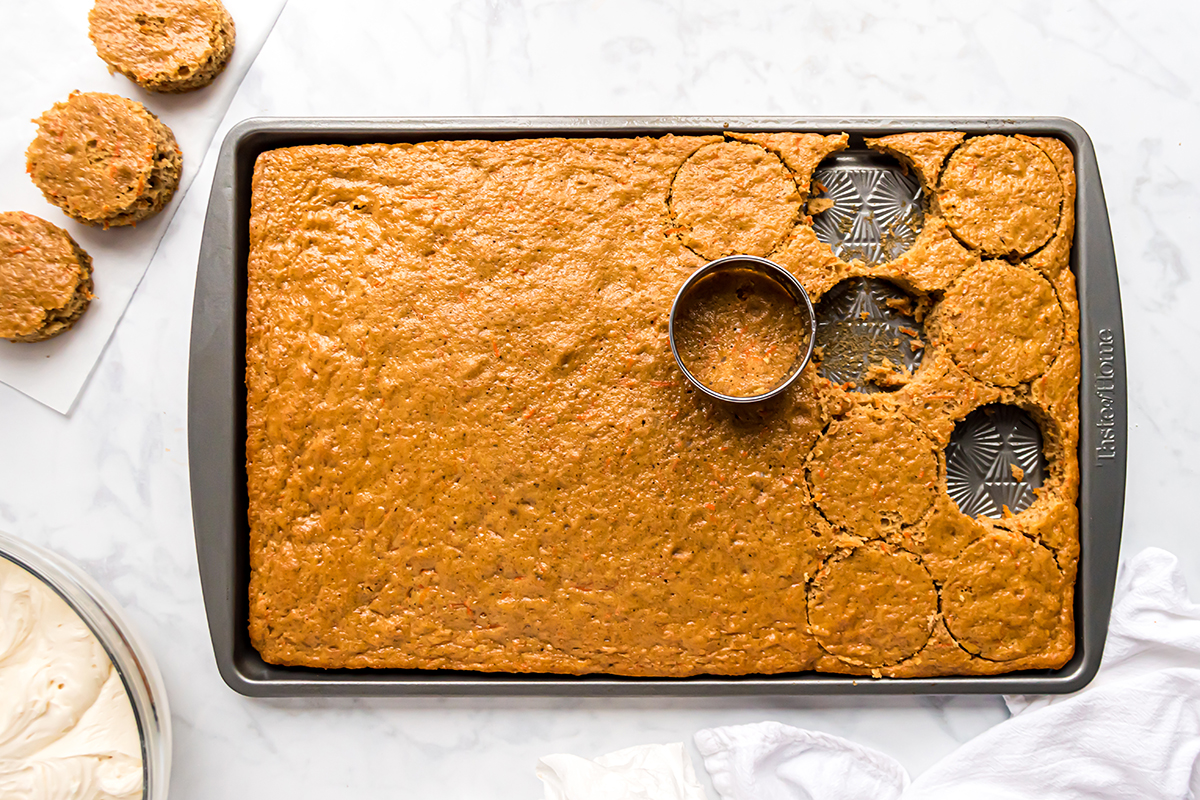 cookie cutter cutting circles of sheet pan carrot cake