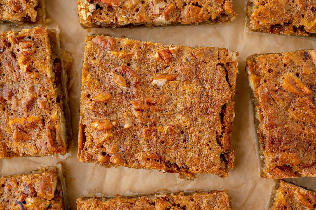 close up overhead shot of cut pecan pie bars