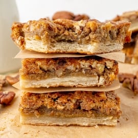 straight on shot of stack of pecan pie bars