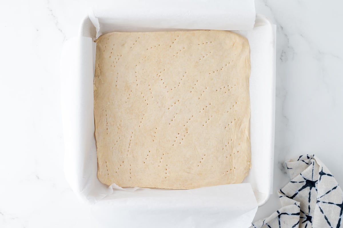 pie dough pressed into pan