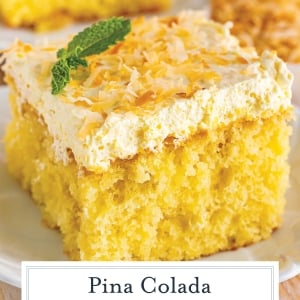 close up slice of pina colada cake with coconut flakes on top