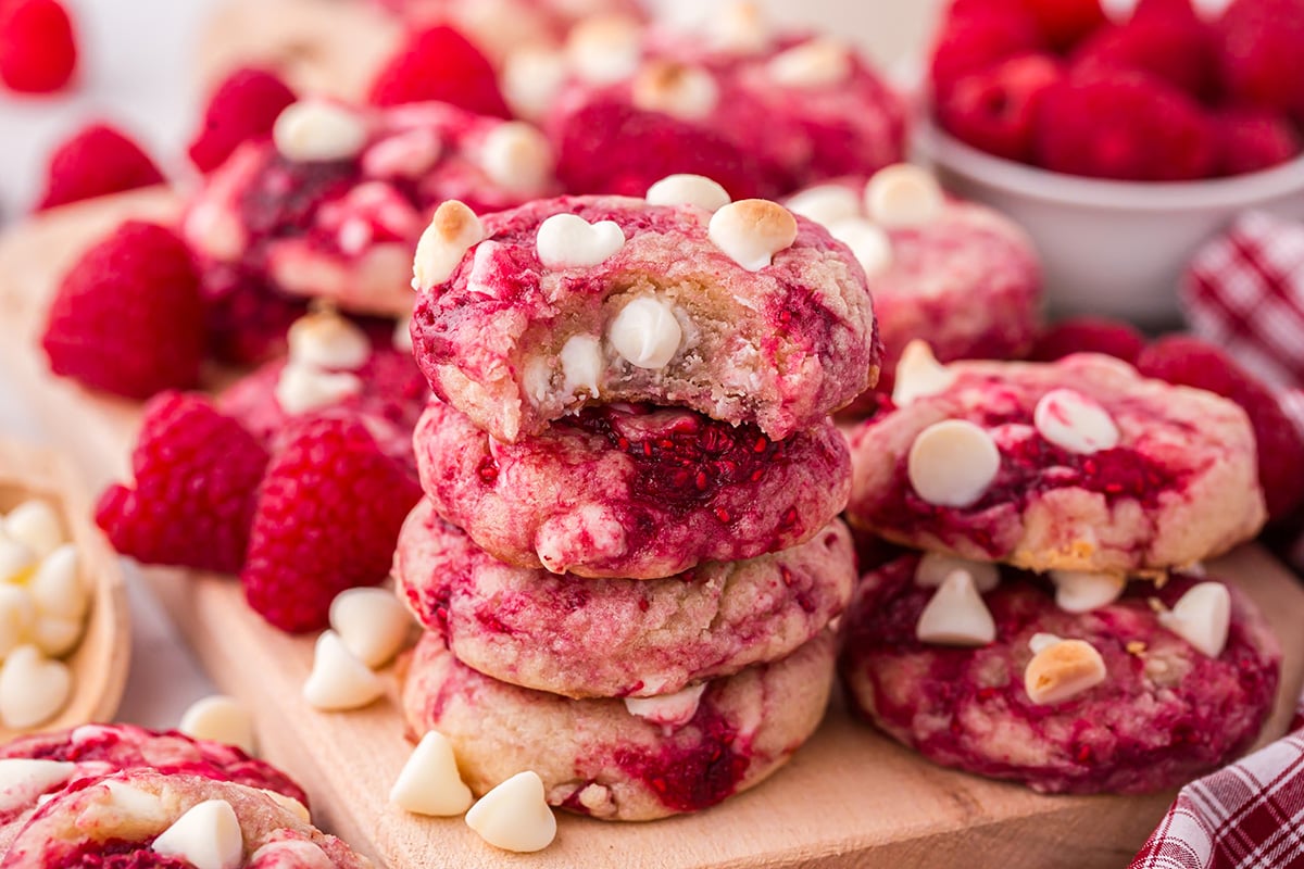 close up of bite taken out of stack of raspberry cookies