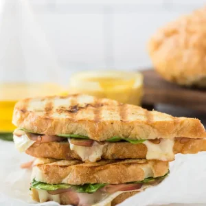 straight on shot of ham and apple panini stacked