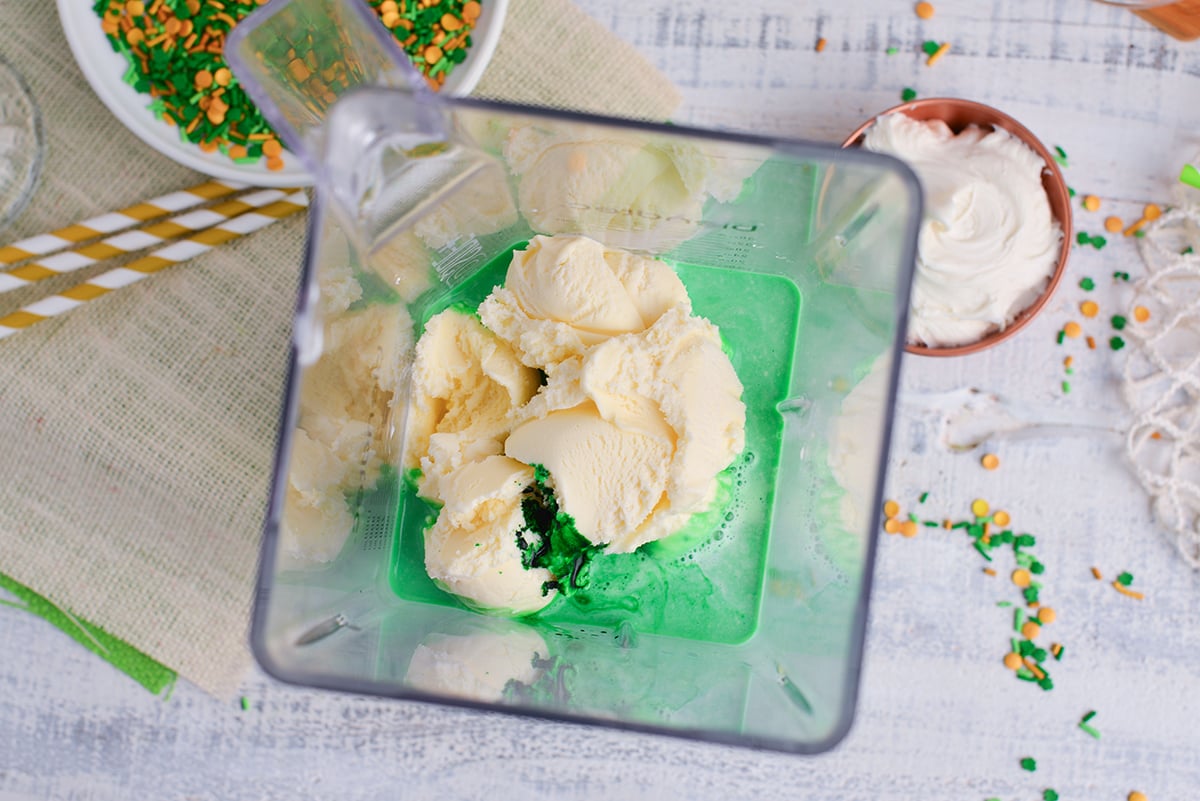 ice cream, milk and green food coloring in blender