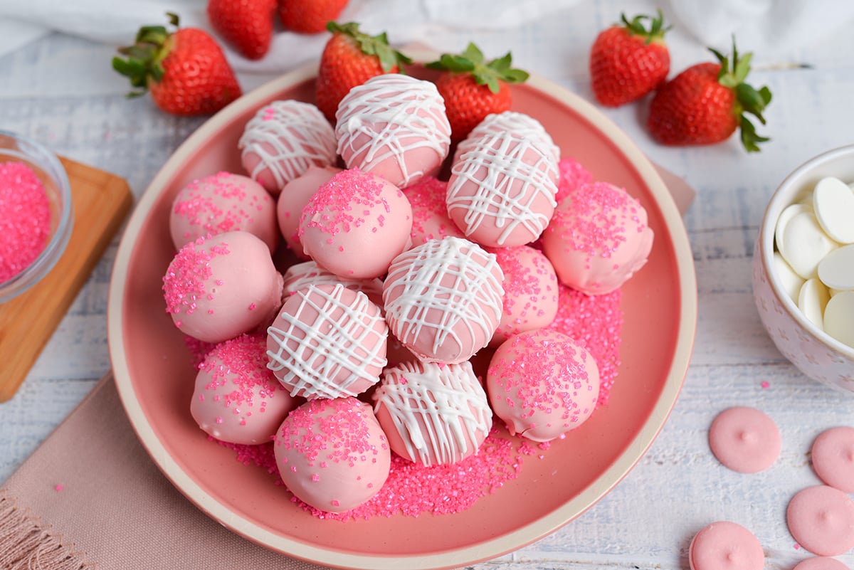 angled shot of plate of strawberry cheesecake bites