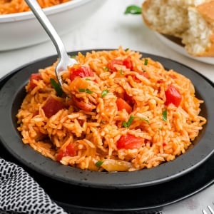 angled shot of fork in tomato rice