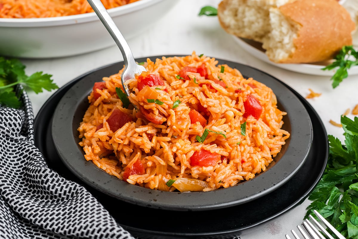 angled shot of fork in tomato rice