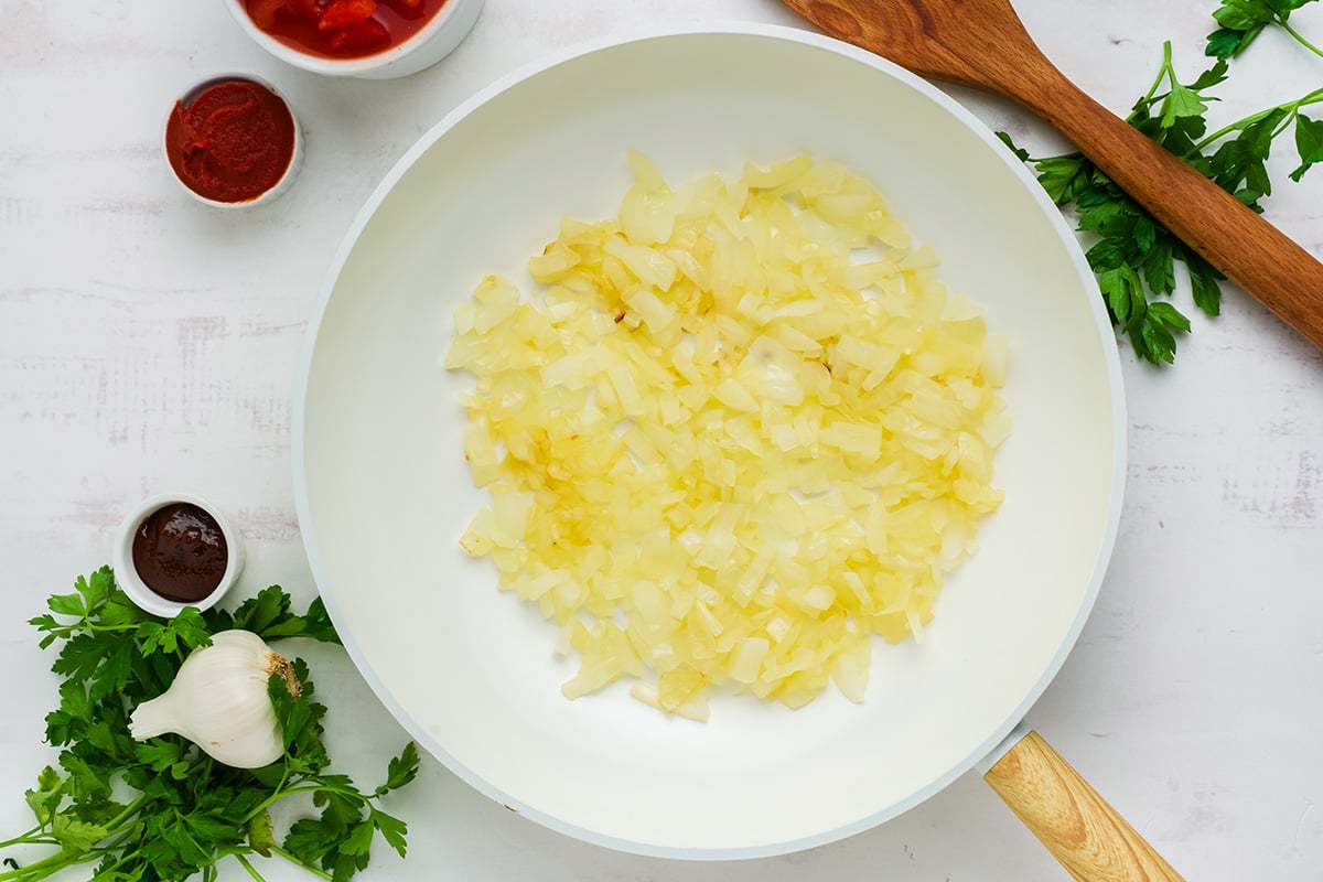 onions sautéing in pan